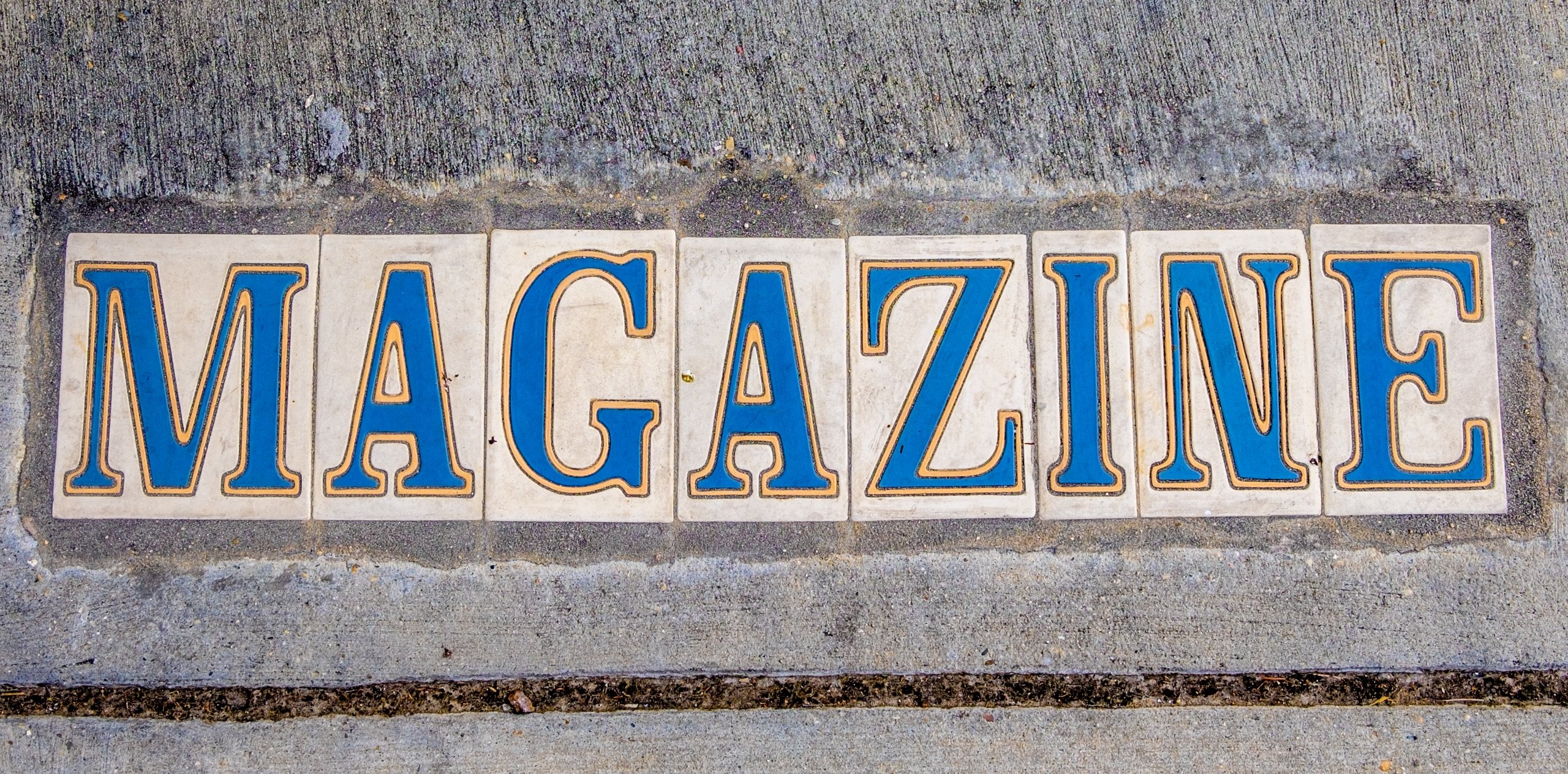 Tiled sidewalk sign for Magazine Street in New Orleans, Louisiana