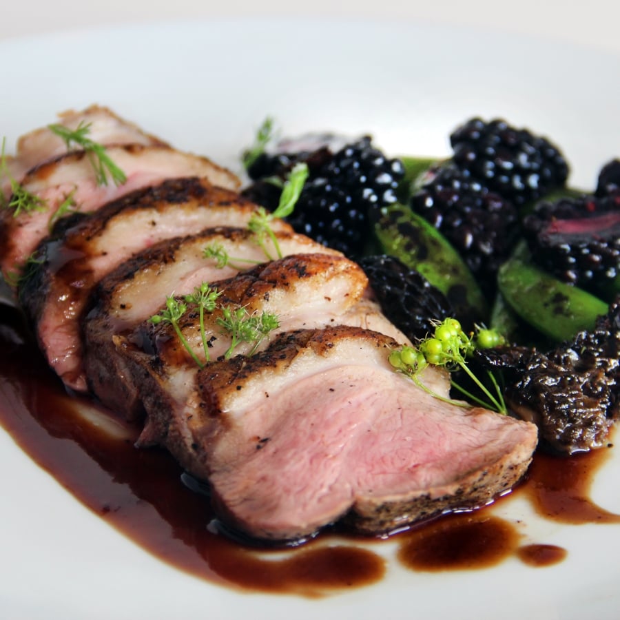 Blackberry lacquered duck breast, with sugar snap peas, wild morel mushrooms, and a blackberry Hoisin sauce